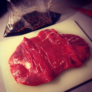 trimmed flank steak-- this piece was about 1 1/2 lbs.-- and marinade in a Ziploc bag